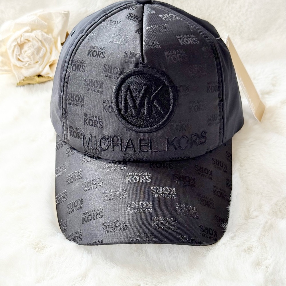 New w/tag Michael Kors Black Monogram Hat with Curved Brim. Hat has a satin feel